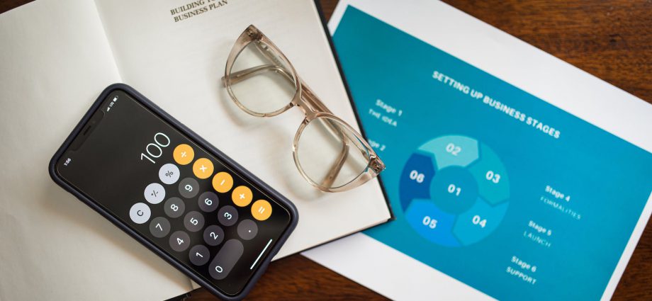 calculator and eyeglasses on document papers